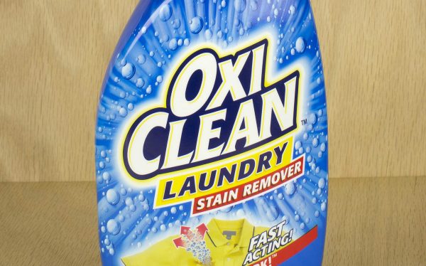 Commercial stain removers like Oxi Clean are always good to keep around the laundry room, to remove grease stains from clothing.